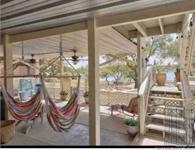 view of patio featuring ceiling fan