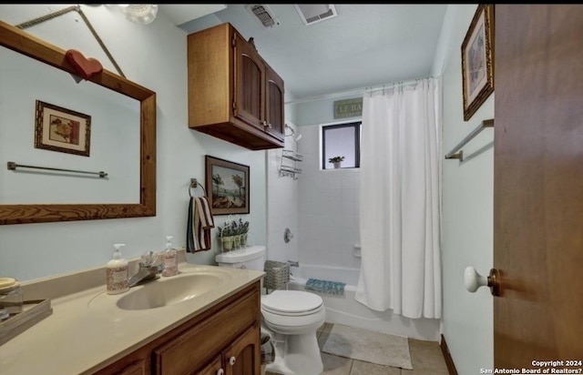 full bathroom featuring shower / tub combo, vanity, tile patterned flooring, and toilet