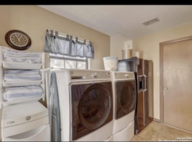 washroom featuring washer and clothes dryer