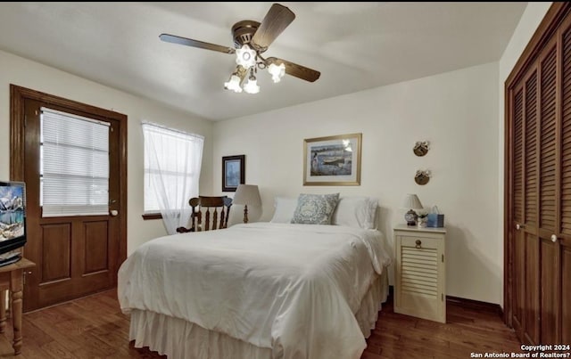 bedroom with dark wood-type flooring, a closet, and ceiling fan