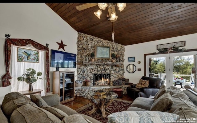 living room featuring hardwood / wood-style flooring, a stone fireplace, vaulted ceiling, and wooden ceiling