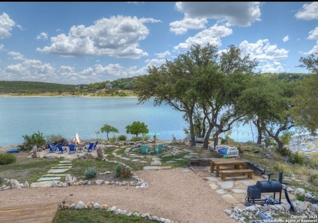 water view with a fire pit