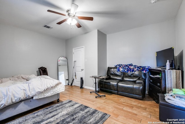 bedroom featuring wood-type flooring and ceiling fan