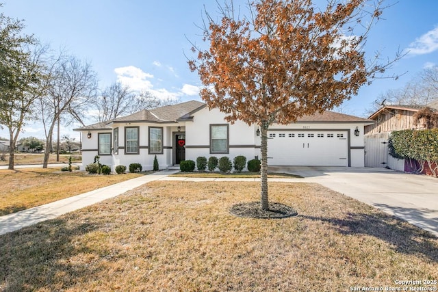 ranch-style house featuring a garage and a front lawn