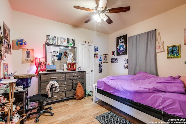 bedroom featuring ceiling fan and light hardwood / wood-style floors