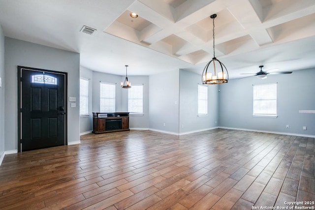 unfurnished living room with hardwood / wood-style flooring, coffered ceiling, and a wealth of natural light