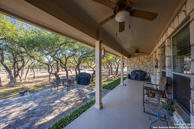 view of patio with area for grilling and ceiling fan