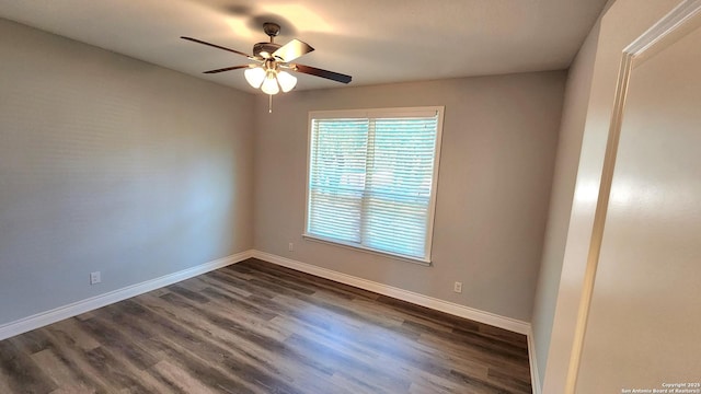 empty room with dark wood-type flooring and ceiling fan