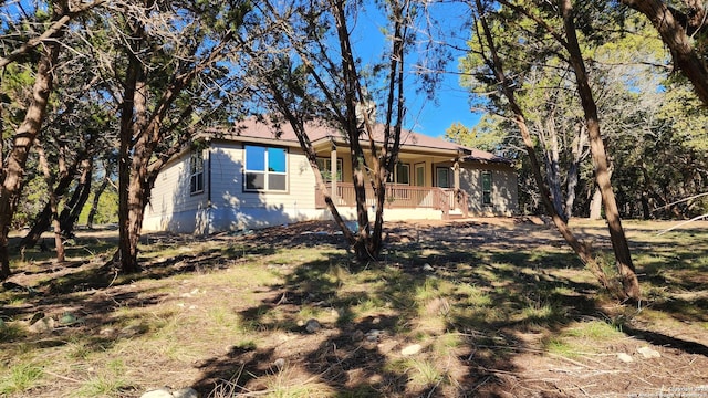 909 Marlys Ave, Canyon Lake, TX 78133 - rear view of house with a porch