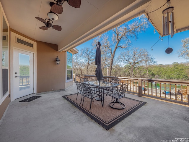 view of patio / terrace featuring outdoor dining area and a ceiling fan