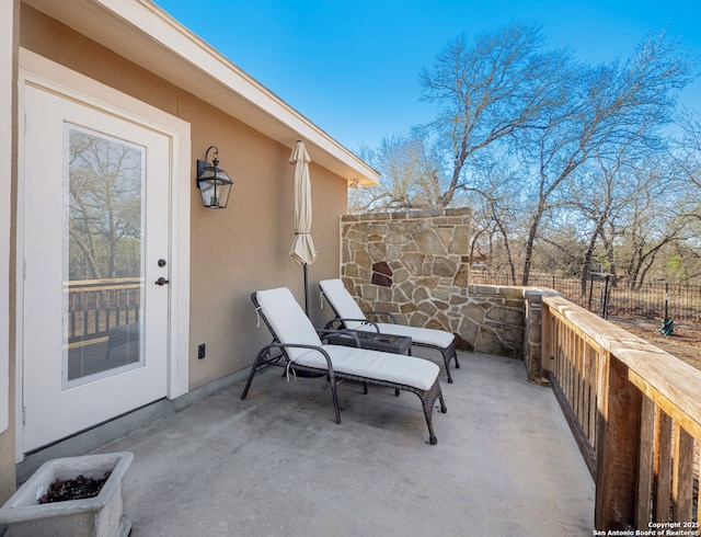 view of patio / terrace featuring fence