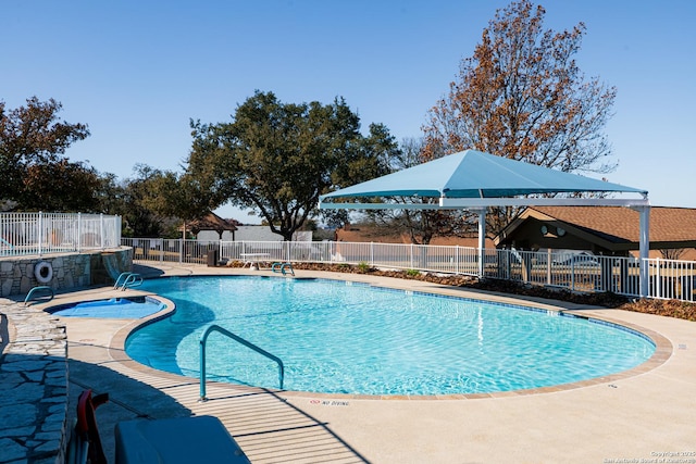 view of swimming pool with a patio area