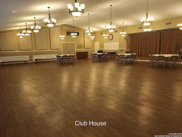 3601 Elm Ct, Schertz, TX 78108 - miscellaneous room featuring wood finished floors, vaulted ceiling, visible vents, and a notable chandelier