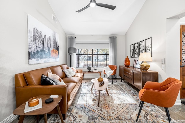 living room featuring lofted ceiling, ceiling fan, and light hardwood / wood-style flooring