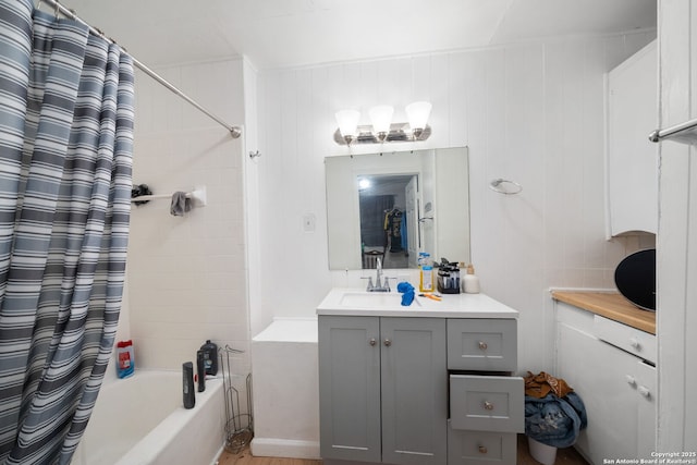 bathroom featuring vanity and shower / bath combo with shower curtain