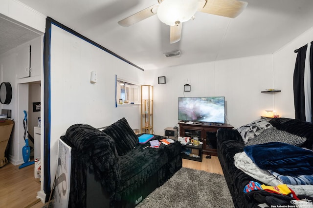 living room with ceiling fan and light hardwood / wood-style floors