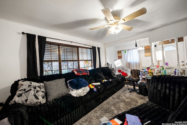 living room with ceiling fan and a healthy amount of sunlight