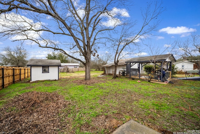 view of yard featuring a gazebo and a storage unit