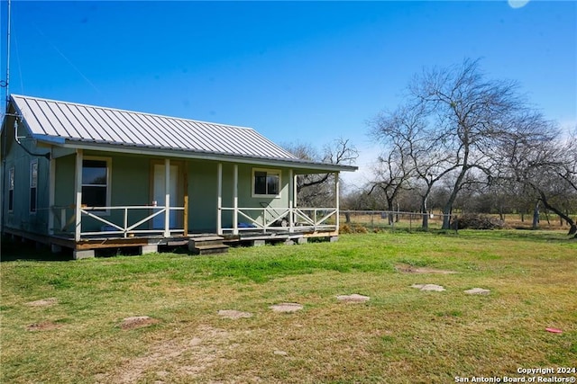 exterior space with a yard and covered porch