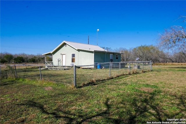 back of property with a yard