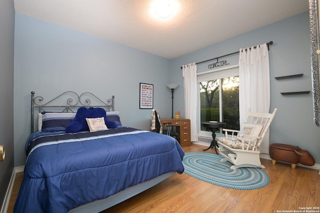 bedroom with wood finished floors