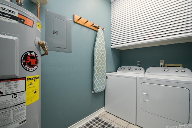 clothes washing area featuring laundry area, electric panel, water heater, separate washer and dryer, and light tile patterned flooring