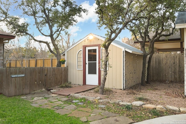 view of shed featuring a fenced backyard