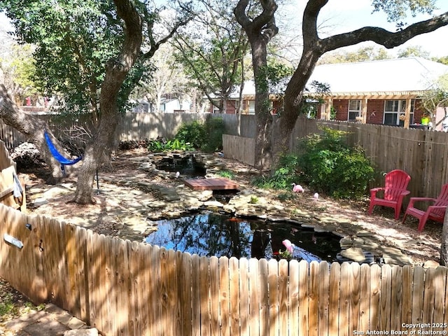 exterior space with a fenced backyard