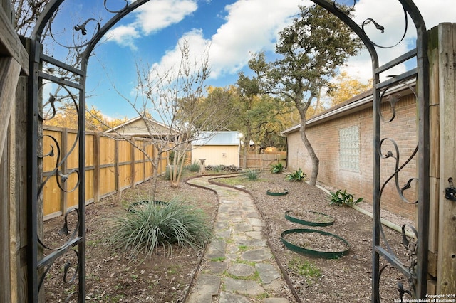 view of yard with a fenced backyard