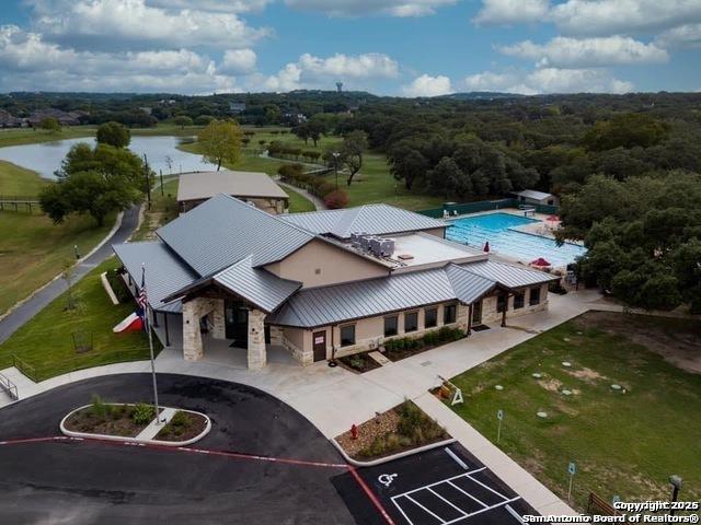 birds eye view of property with a water view