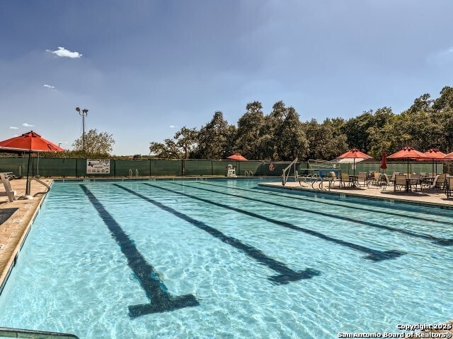 community pool with fence