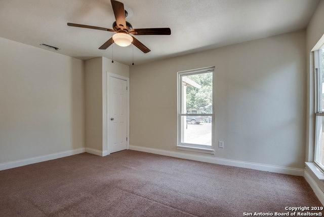 spare room featuring ceiling fan and carpet flooring