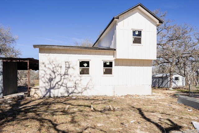 view of property exterior with a storage shed