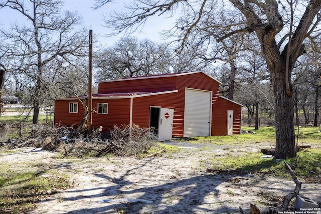 view of outbuilding with a garage