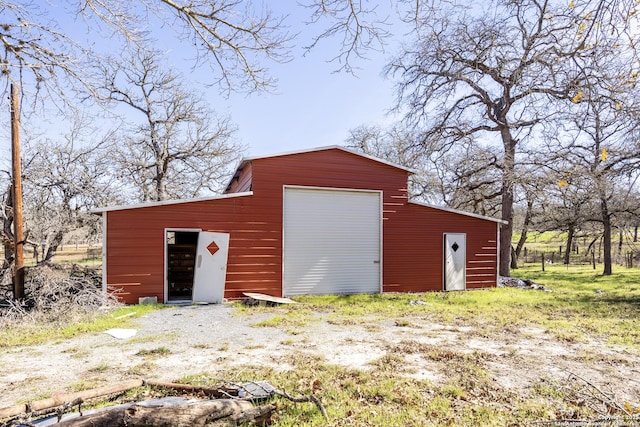 view of outbuilding with a garage