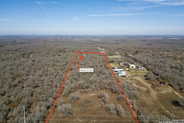 birds eye view of property featuring a rural view