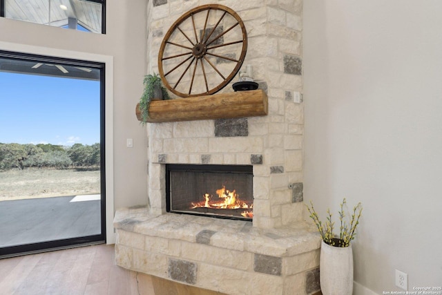 interior details with hardwood / wood-style flooring and a fireplace