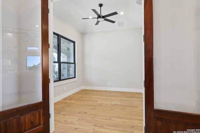 unfurnished room featuring ceiling fan and light wood-type flooring