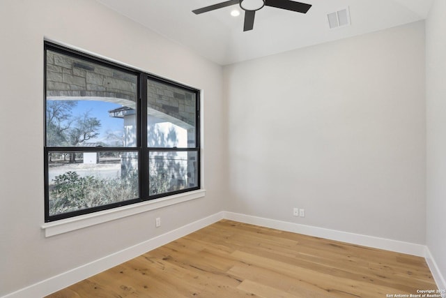 empty room featuring ceiling fan and wood-type flooring