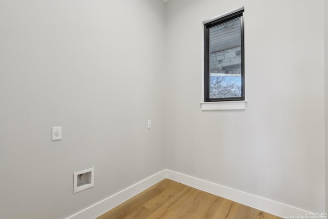 washroom featuring hardwood / wood-style flooring, electric dryer hookup, and washer hookup