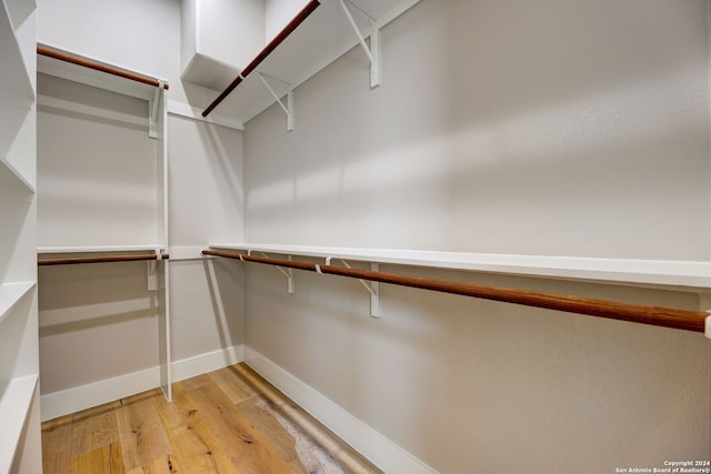 walk in closet featuring light hardwood / wood-style floors