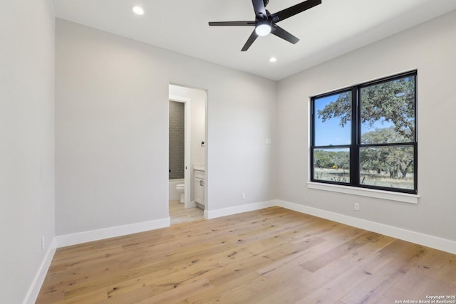 empty room featuring light hardwood / wood-style flooring and ceiling fan