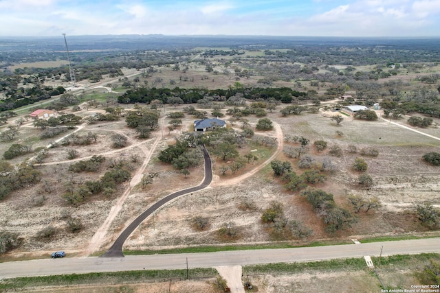 birds eye view of property featuring a rural view