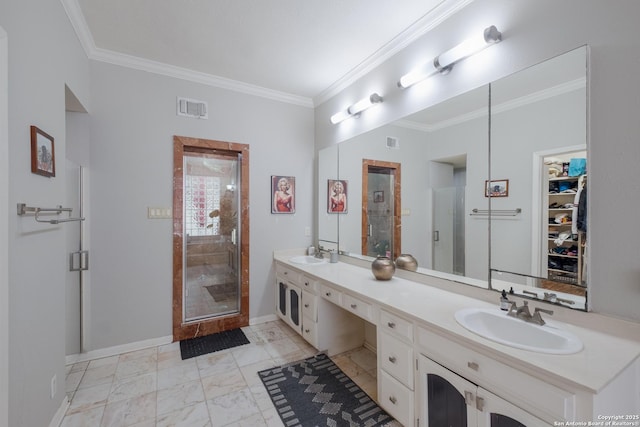 bathroom with crown molding, vanity, and walk in shower