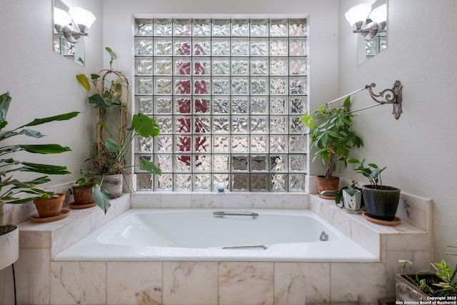 bathroom featuring a relaxing tiled tub