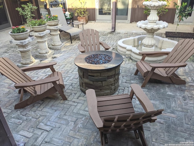 view of patio / terrace featuring an outdoor fire pit