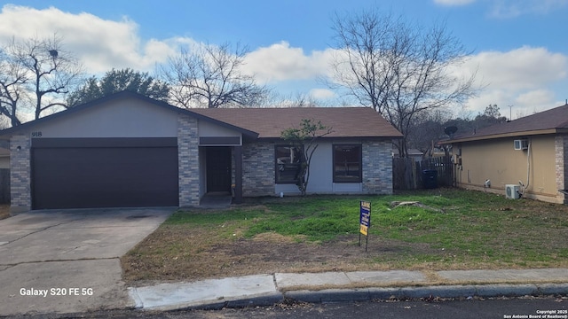 view of front of home with a garage and a front yard