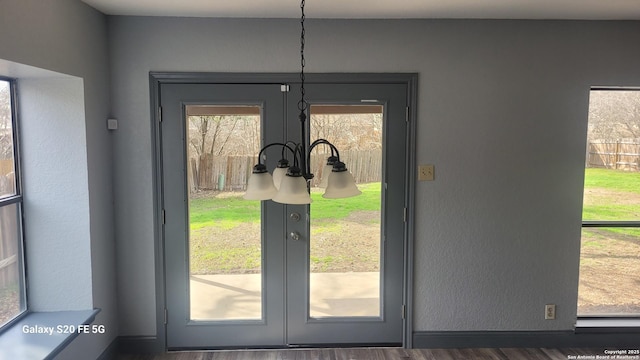 entryway featuring french doors and dark hardwood / wood-style flooring