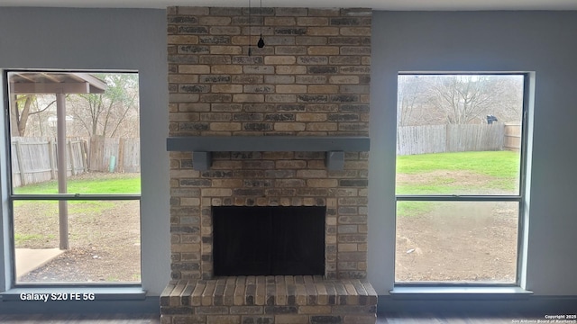 details featuring a brick fireplace