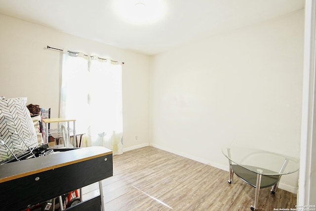 office area with a healthy amount of sunlight and light hardwood / wood-style flooring